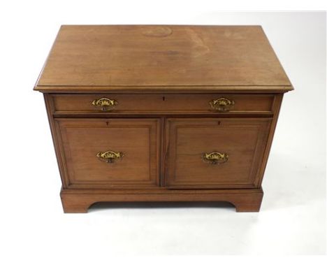 A Victorian pale walnut side cabinet, the rectangular top above a central frieze drawer before a pair of large deep drawers w