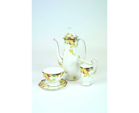 A Royal Doulton Art Deco coffee service in the Honesty pattern, H3768, decorated with green, yellow and red leaves against a 