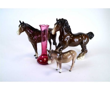 Four Beswick horses in dark brown gloss comprising a Cantering Shire, a foal, Showhorse and one further horse together with a