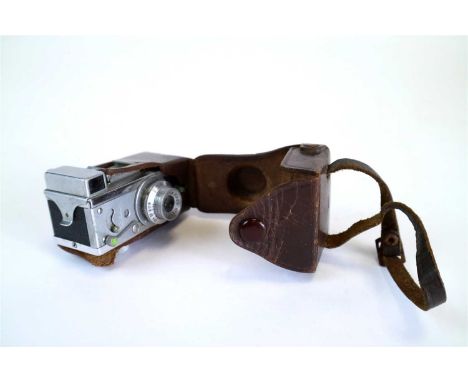 A Steky Model IIIB miniature camera, in original leather case, the lens marked Riken Stekinar 1:3.5 F= 2.5 cm, for use with 1