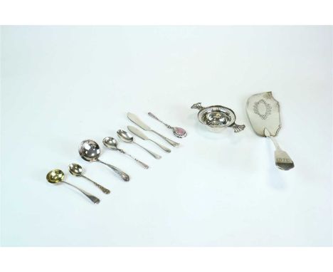 A miscellaneous collection of flatware, comprising; a pair of salad servers, three butter knives, five teaspoons, a fish slic