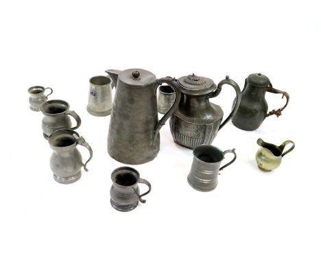 A large collection of antique pewter wares to include 15 various tankards, a pair of candlesticks and a further single candle