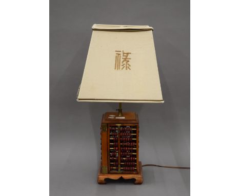 A Chinese table lamp. 66 cm high overall.