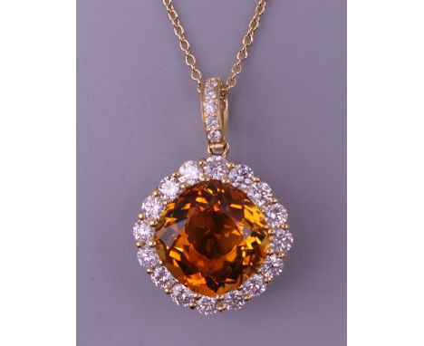 An 18 ct gold citrine and diamond pendant on an 18 ct gold chain. Approximately 0.80 carat of diamonds. The pendant 1.5 cm wi