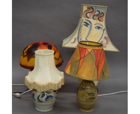 A Galle style glass table lamp and three pottery table lamps. The former 36 cm high.