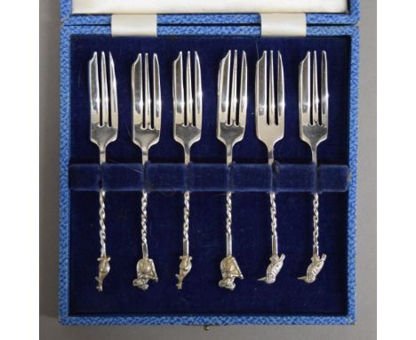 A cased set of cake forks, each finial with an Australian animal.