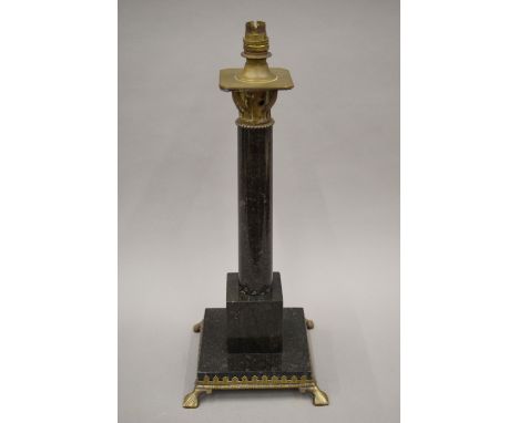 An early 20th century Arts and Crafts marble and brass decorated table lamp. 51 cm high.