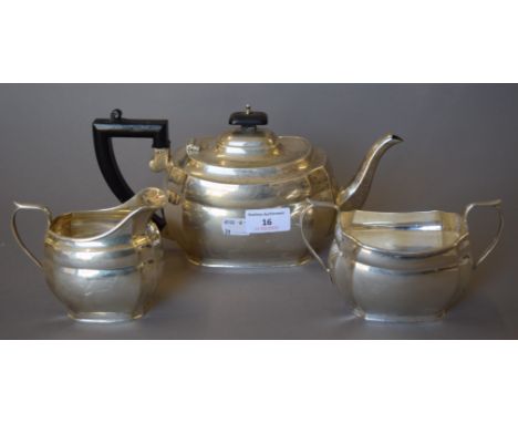 A matched three-piece silver tea set. The teapot 27 cm long. 825.4 grammes total weight. 