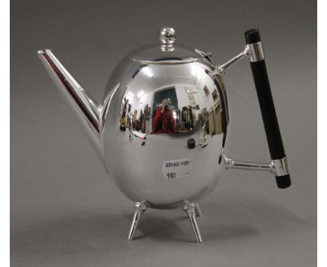 A Christopher Dresser style teapot. 17 cm high.