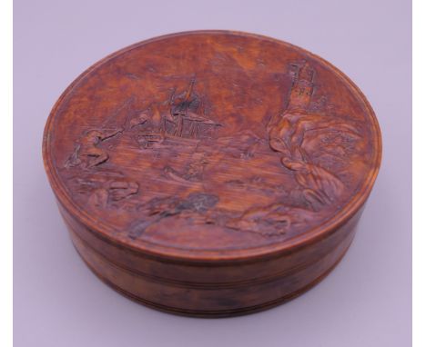 A 19th century carved burr wood and tortoiseshell snuff box. 8 cm diameter.