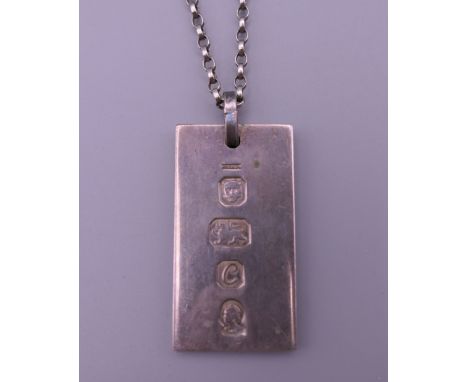 A silver ingot pendant on a silver chain. 22.2 grammes. 