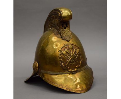 A vintage brass fireman's helmet. 26 cm high.