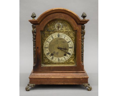 A Victorian walnut mantle clock. 34.5 cm high.