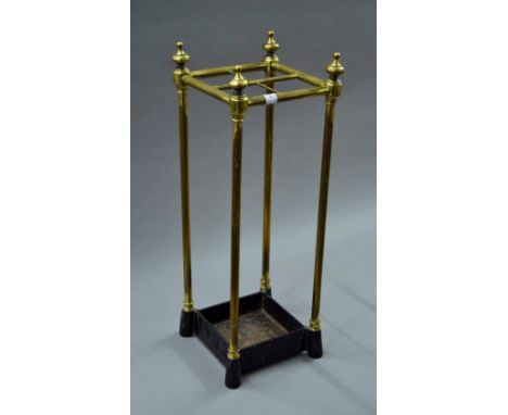 A Victorian brass and iron stick stand. 61 cm high.