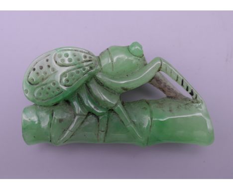 A jade model of a fly on bamboo. 6.5 cm long.