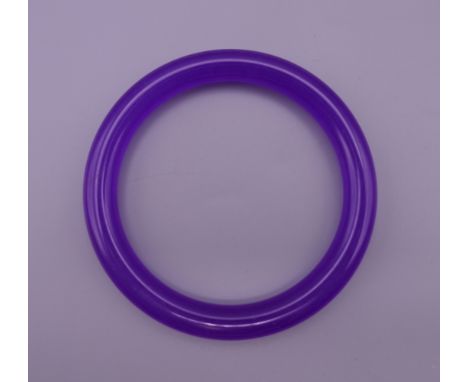 A lavender jade bangle. 6 cm interior diameter. 