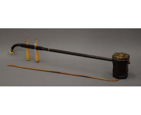 A Chinese string instrument. 80 cm long.