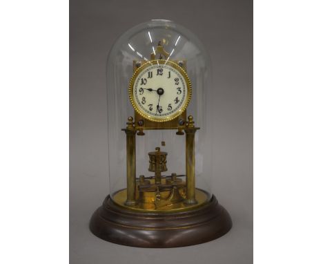 An Anniversary clock under glass dome. 26 cm high.