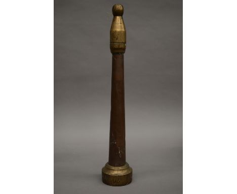 Three vintage copper and brass fire hoses. The largest 52 cm high.