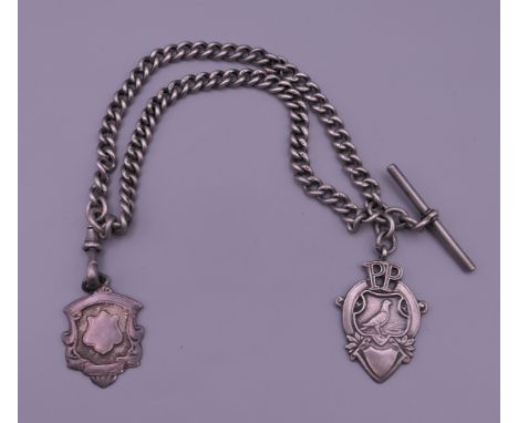 A silver watch chain and two silver fobs. 27 cm long. 56.1 grammes. 