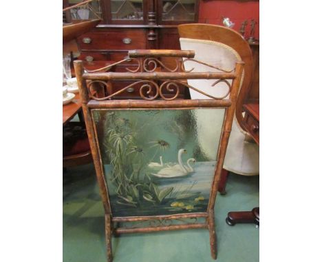 A painted bamboo fire screen 
