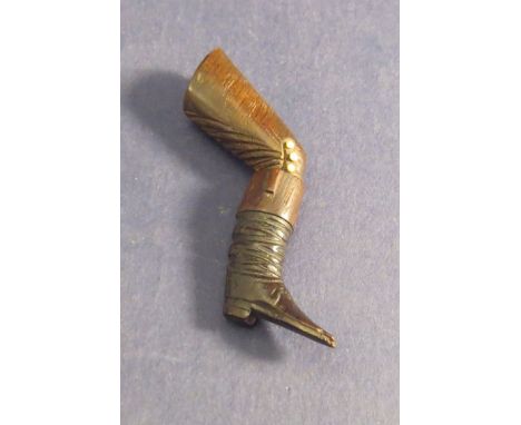 A Victorian pipe tamper in the form of a leg and boot 