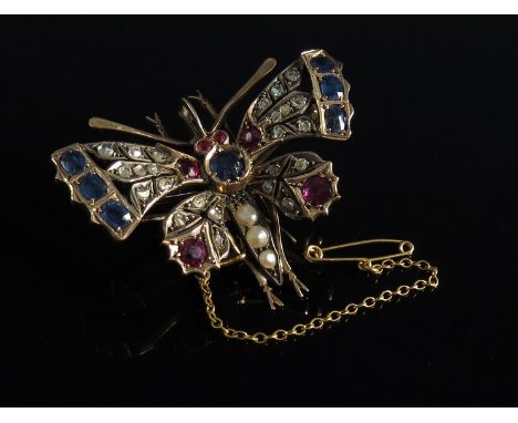 A Victorian butterfly pendant with interchangeable brooch attachment, the central round cut Ceylon sapphire with pearl thorax