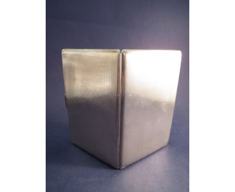 A silver engine turned cigarette case, London 1946