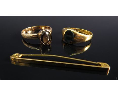 An 18ct gold bloodstone set signet ring and another with a 9ct gold tie pin (3)