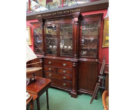 An early to mid 19th Century mahogany breakfront bookcase with architectural pediment, astragal glazed doors, with secretaire