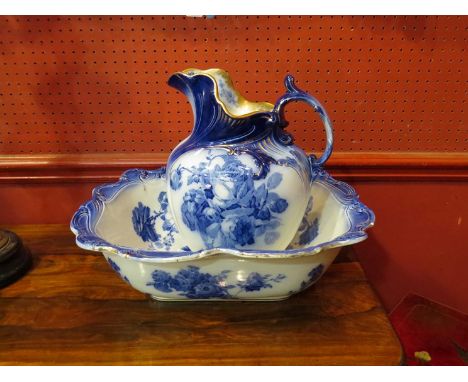 A Royal Doulton flow blue jug and basin
