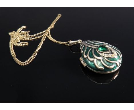 An enamel peacock feather locket on silver chain 