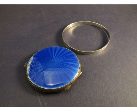 A silver compact with blue guilloche lid a/f, with mirrored interior with a silver bangle (2)