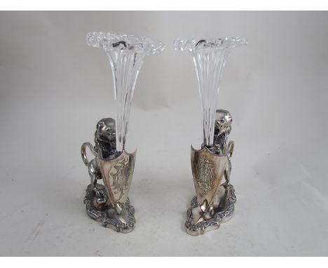 A pair of Walker & Hall plated single epergne as Lions with shields, single glass trumpets 