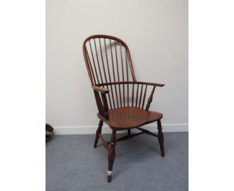 A 19th Century stick-back Windsor armchair with elm seat 