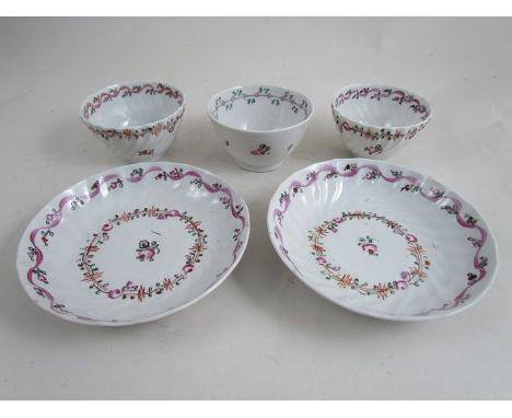Two Newhall tea bowls and saucers and another tea bowl all decorated with pink flowers (5) 