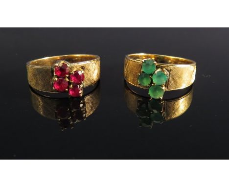 A four stone ruby set ring with "brushed" shoulders stamped 18k and another emerald example (2)