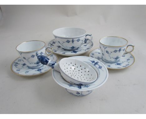 A pair of 20th Century Royal Copenhagen blue and white lace pattern coffee cups and saucers, strainer (cracked) a patty pan, 
