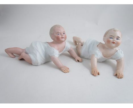 A pair of ceramic piano babies, Dep 1338