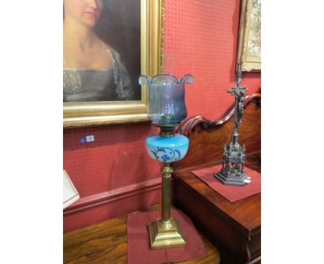 A late Victorian Duplex oil lamp with tinted blue glass shade over two tone glass reservoir with hand-painted Art Nouveau sty