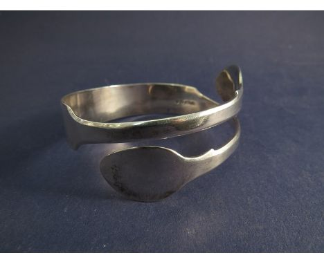 A heavy Victorian silver torc bangle made from a spoon, hallmarks London 1843