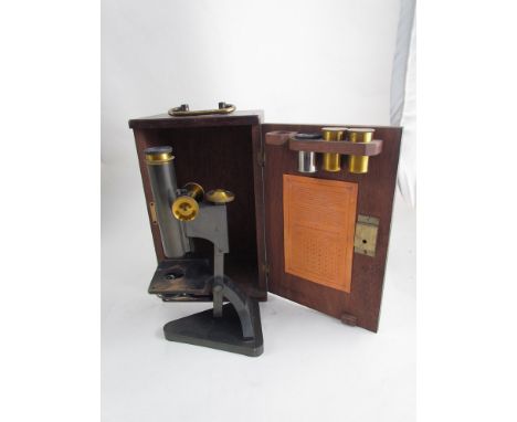 A cased microscope, maker's name R & J Beck 