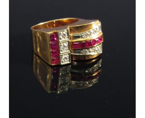 A gold Art Deco diamond and ruby ring set with square cut rubies and round cut diamonds