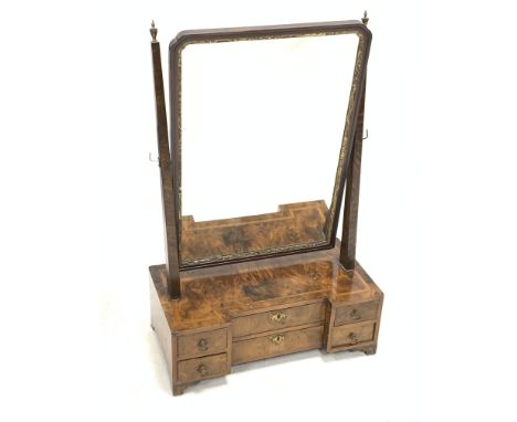 George III burr walnut toilet mirror, rectangular plate within a gilt foliate slip, inverted breakfront six drawer base with 