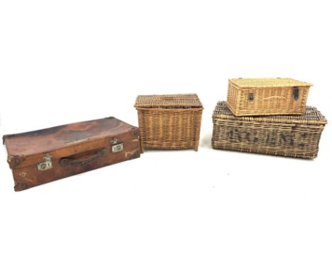 Early 20thCentury leather suitcase with shipping labels, L76cm, two wicker baskets and a wicker fishing creel containing vint