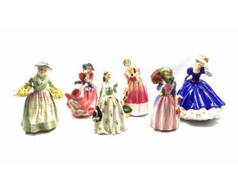 Six Royal Doulton figures comprising Carolyn, Miss Demure, Top O' the Hill, Daffy, Queen Victoria limited edition No.1394 and