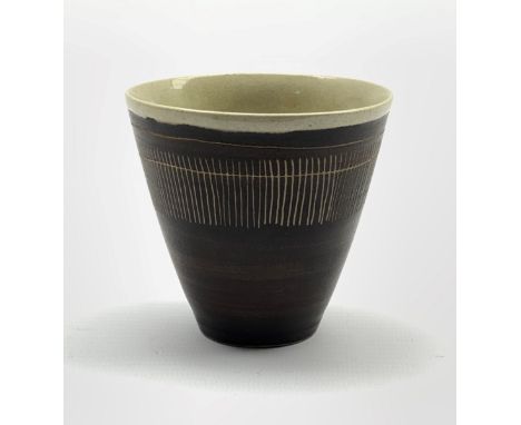 Dame Lucie Rie D.B.E (1902-1995) a stoneware beaker decorated to the exterior with sgraffito lines in a manganese glaze over 