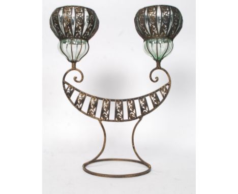 An unusual decorative 20th century Asiatic style cast metal twin candle holder lamp - decorated glass holders, with armorial 