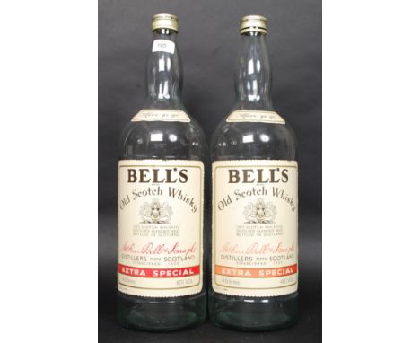 A pair of vintage oversized shop advertising Bells Whiskey bottles. H50cm 