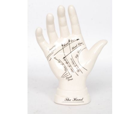 A `Palmistry` ceramic hand for instruction purposes. H16 cm 